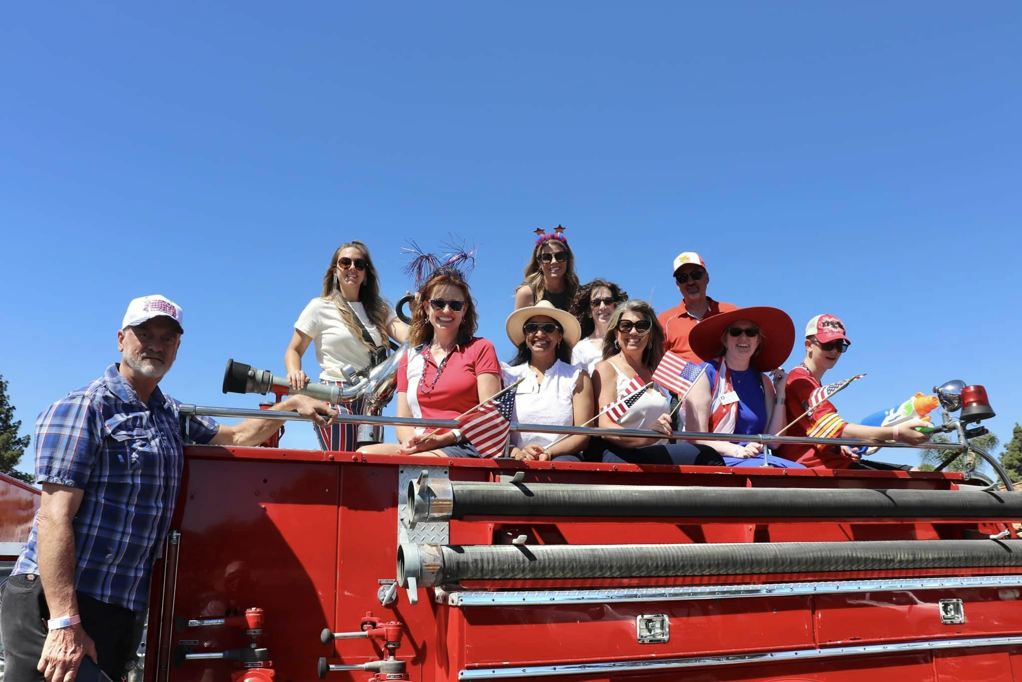 Poway Unified VIPS sitting on an red fire truck